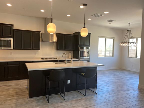 Quarts Countertops, gas cooktop, built-in microwave, & large island