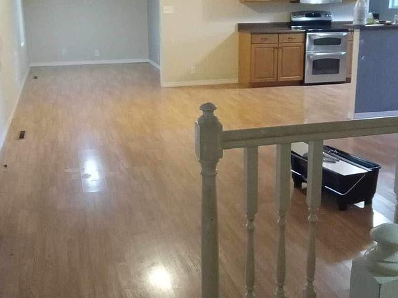 This viewing coming into the front door to the left living room kitchen and kitchen nook with smoke detectors fireplace newly painted going down the stairs 15 to the lower basement two rooms on the left hand side on the right