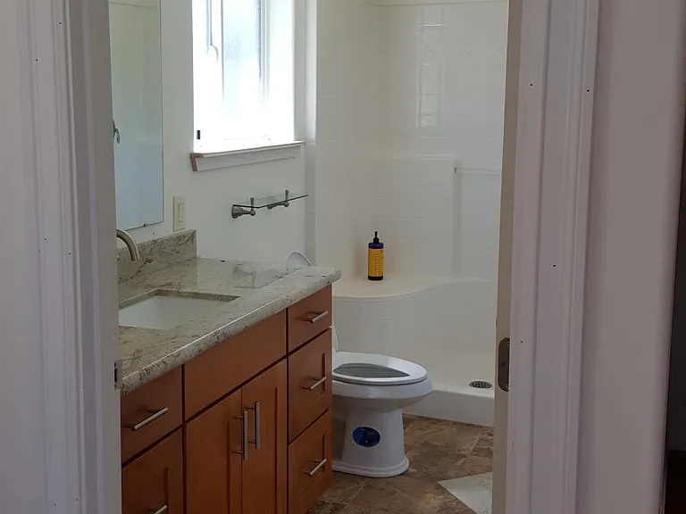 Master bath with spacious shower including built in seat