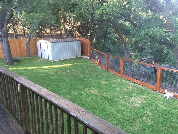 New fenced back yard with new storage shed (10'X14')