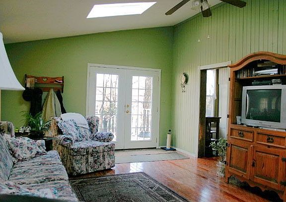 Family Rm. w/ vaulted ceiling, skylights, hardwood floor