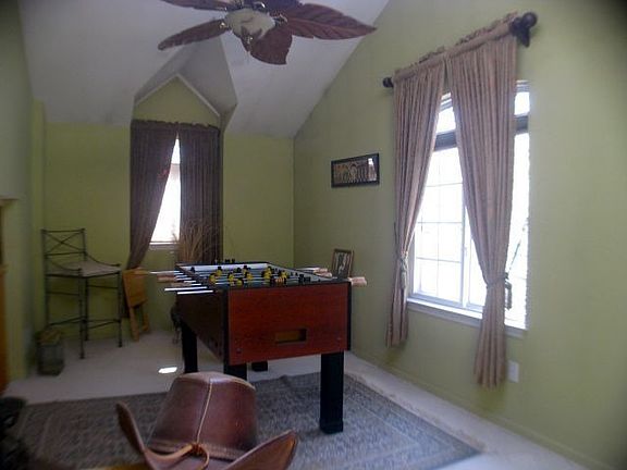 family room with skylight and vaulted ceilings