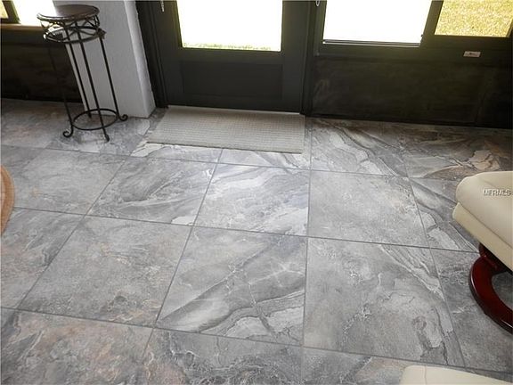 fNewly Installed Porcelain Tiled Floor on Lanai