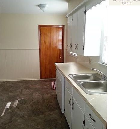 Kitchen door goes to Garage.