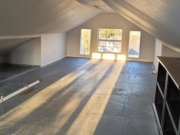 Upstairs Attic and playroom. Spans the full length of the house. The attic is accessible from the second bedroom via stairs.