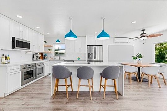Kitchen (upstairs)
Enjoy this chef''s kitchen with a utility sink, hot water dispenser, 2 dishwashers, 2 ovens, convection oven microwave, Thermadore 6-burner induction stove with downdraft, and much more.