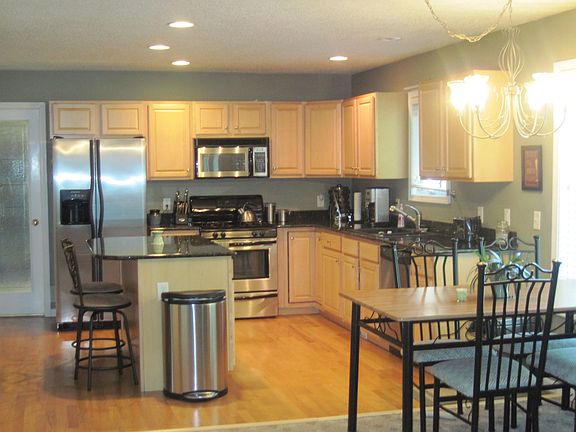 Beautiful Kitchen with Granite Counters and Stainless Steel Appliances