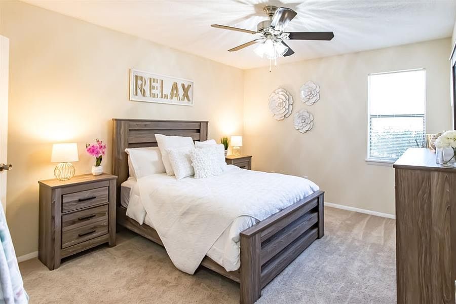 Spacious Bedroom with Wall-to-Wall Carpeting & Ceiling Fan