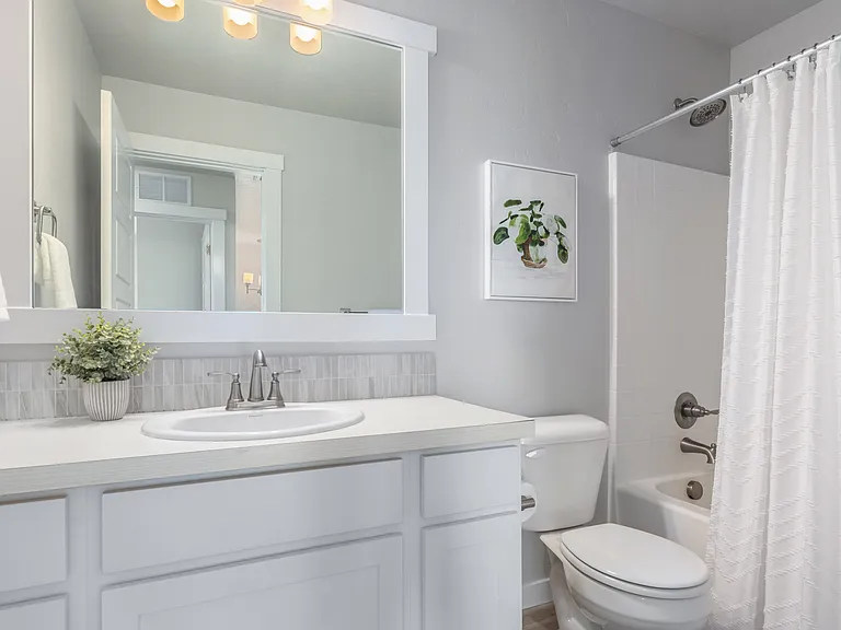 Full bath with tub, upstairs and across from bedrooms.
