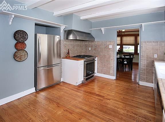Kitchen with gas range and stainless steel appliances