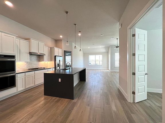 Gorgeous gourmet kitchen. Office on the right.