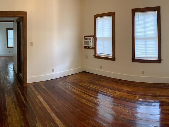 Living room with wood floors and lots of natural light (pano)