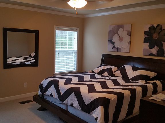 Master bedroom from entry, windows facing backyard