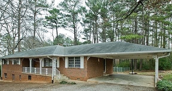 Spacious Mid-Century Brick home with Carport