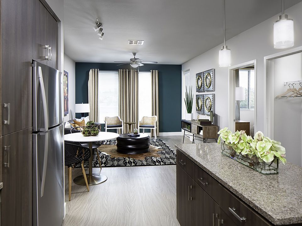 Wood-look plank flooring extends into the living room
