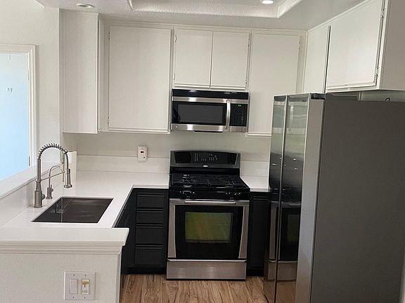 Kitchen with included refrigerator.