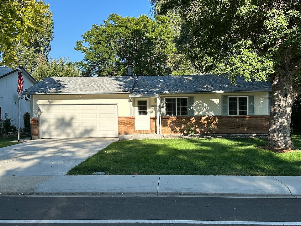 Front of House with Attached Large Two Car Garage and Driveway: attached tool shed connected to backyard and garage.