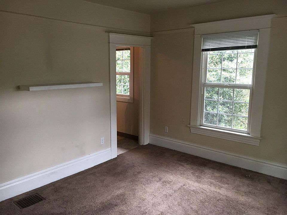 Main living room leading to kitchen.