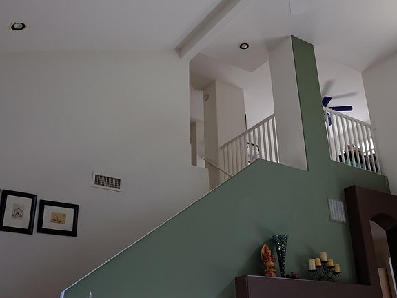 Staircase leads to bedrooms and loft