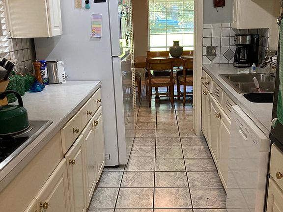 Kitchen with French doors that open to Dining Room