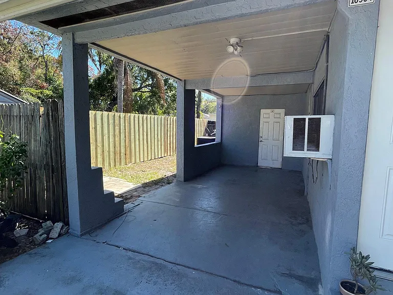 Carport and entrance to utility room