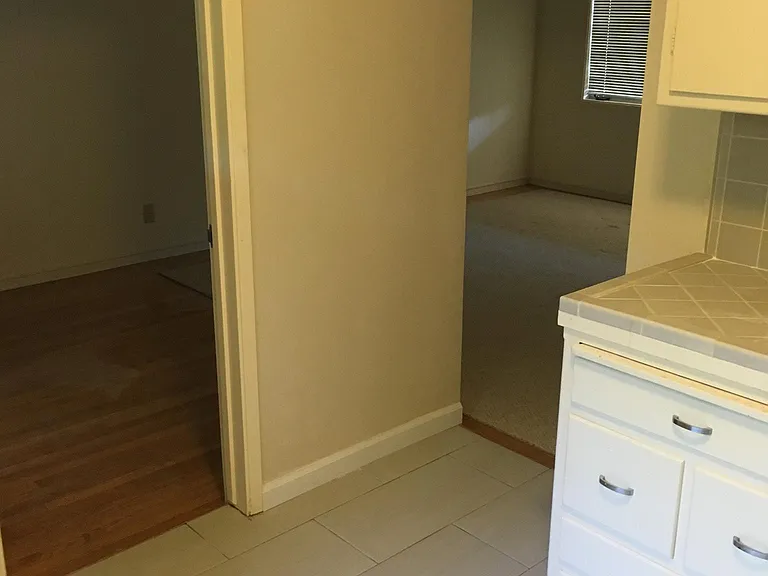 Kitchen with doors to bedroom and living room