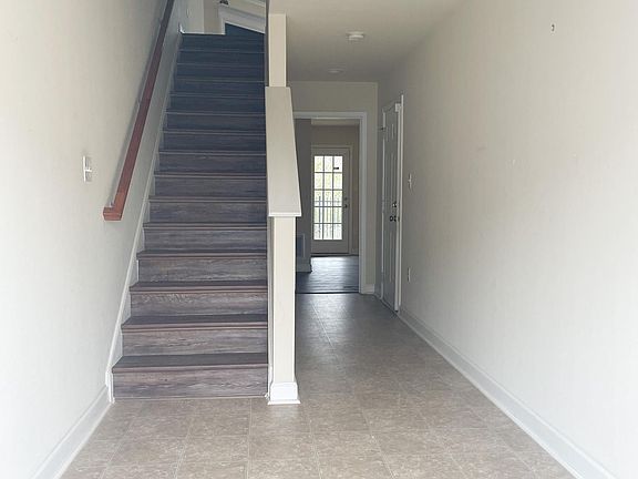 Spacious First Floor Entryway, leading to Large Bedroom or Office with Private Bath (Access to private Patio through this room as well)