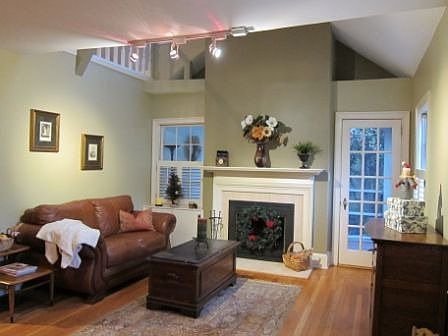 Screened In Porch Behind Fireplace Wall