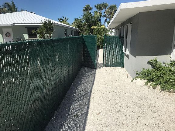6' Privacy fencing three sides and locking gates to secure back