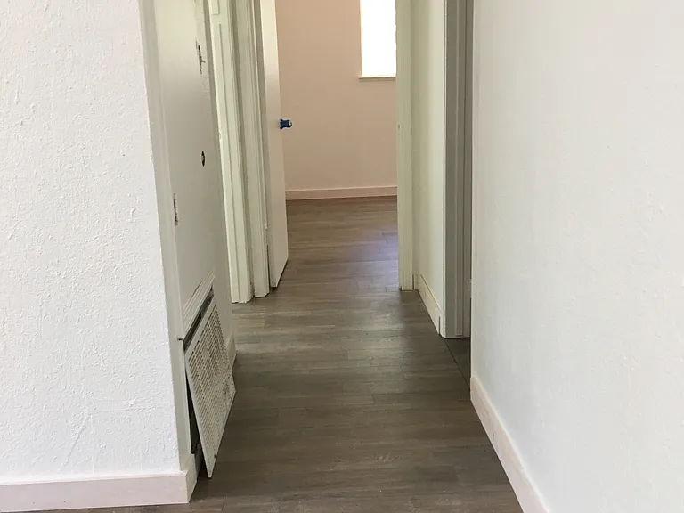 Larger bedroom is on the left, smaller bedroom ahead
Bathroom on the right