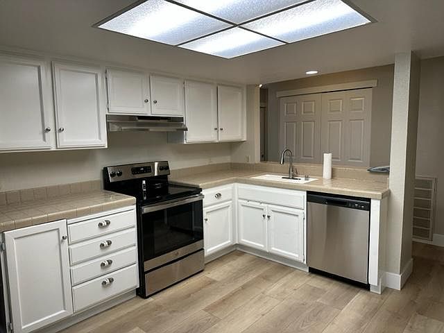 Kitchen with stainless steel appliances.