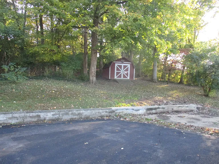 Spacious back yard with storage building