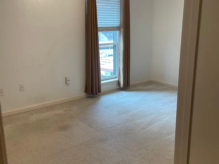 bedroom with new carpet has walk-in closet and attached bath