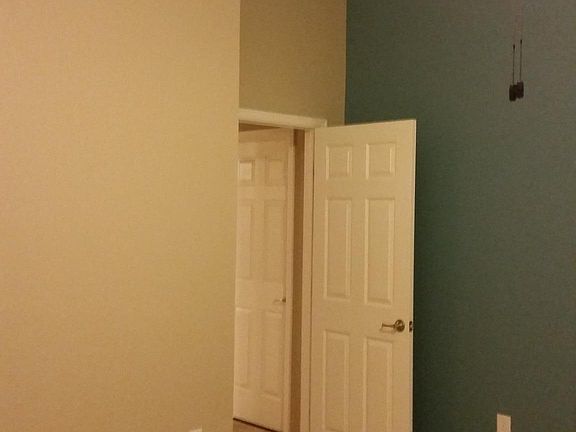 Master bedroom with vaulted ceiling.