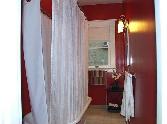 Bathroom with clawfoot tub & pedestal sink