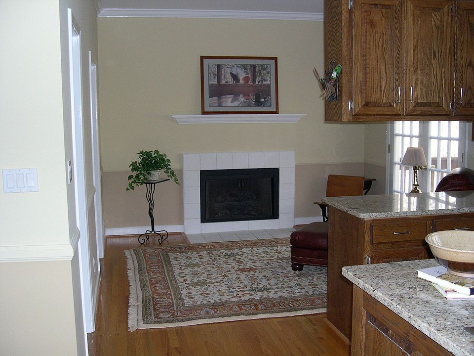 Keeping Room with fireplace and french doors leading to the deck