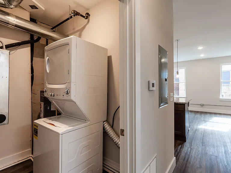 Equipped laundry room offers additional storage. There is also a linen closet.