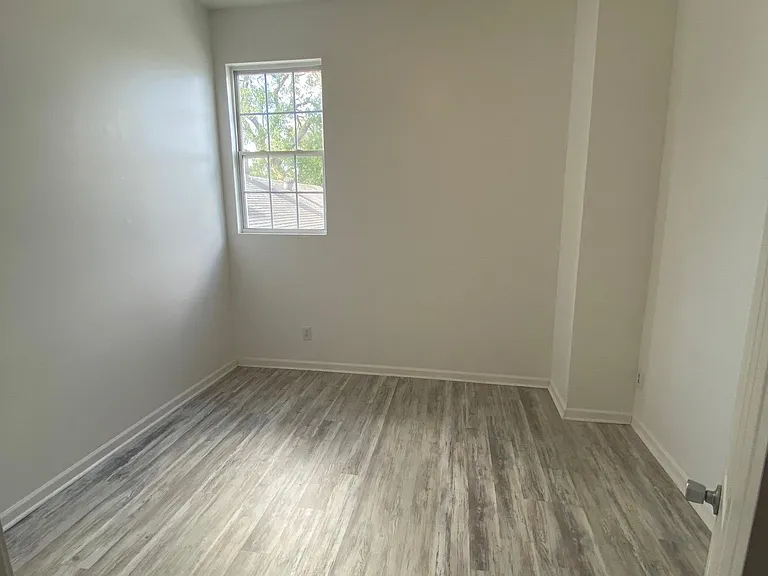 Upstairs master bedroom with adjacent walk-in closet