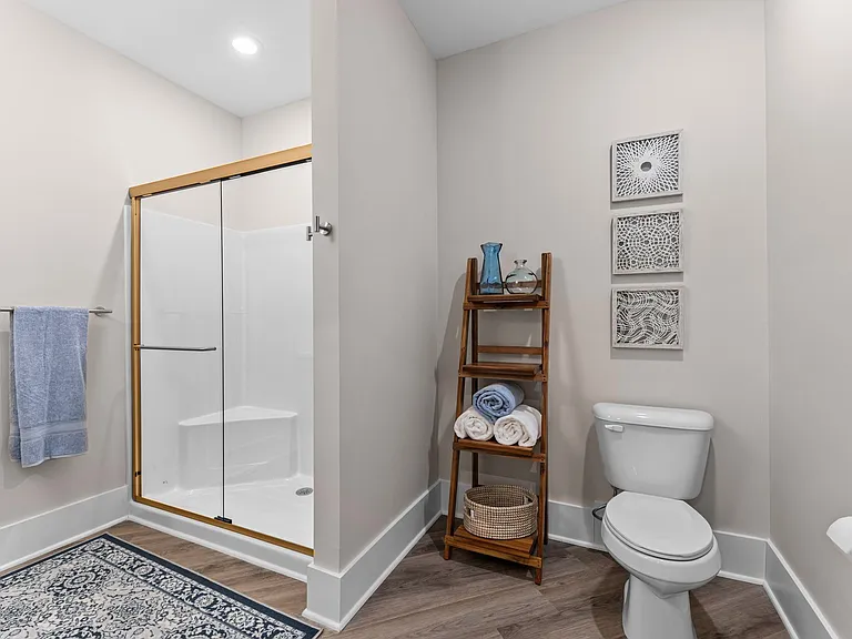 Active Adult bathroom with a shower and a toilet