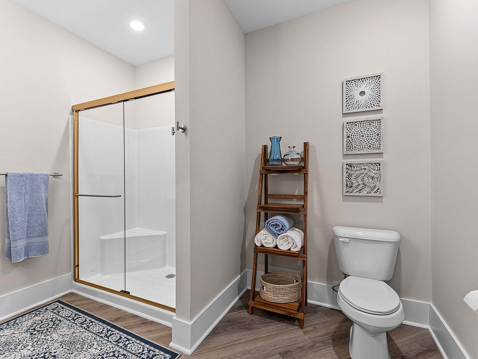 Active Adult bathroom with a shower and a toilet