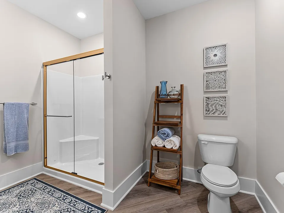 Active Adult bathroom with a shower and a toilet
