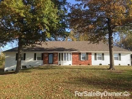 Front
						:
						Looking east with (2) grown Pin Oaks in front