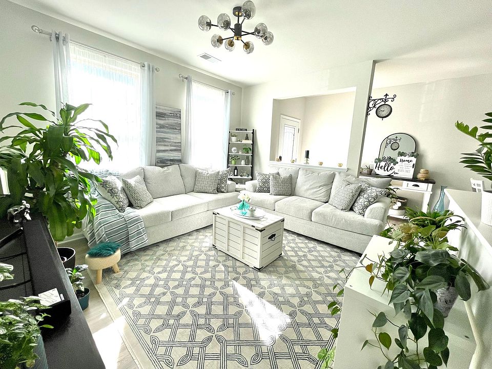 Bright and Inviting Living Room

Furniture in the living area includes Couch, Coffee table, TV & TV Stand and Storage