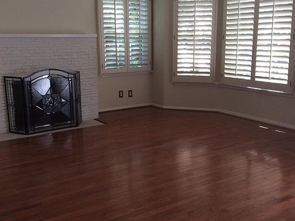 Living room with wood burning fireplace