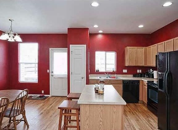 Kitchen with the dining area with hardwood floors and all the appliances