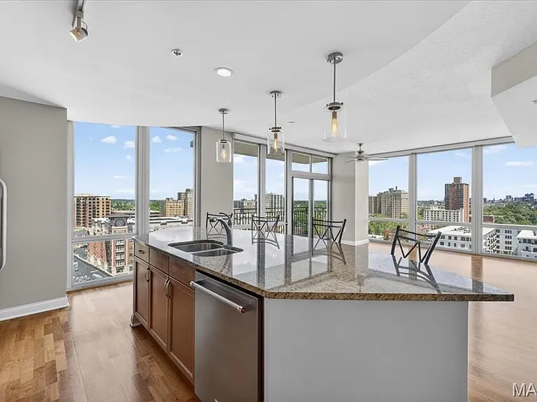 Kitchen island with granite countertop and double stainless steel sink
