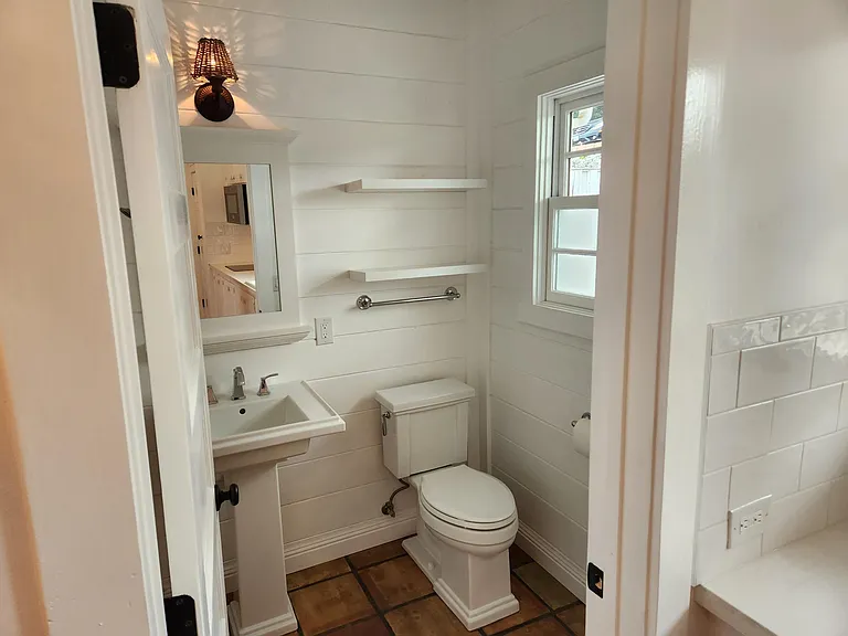 Bathroom with new fixtures and character.