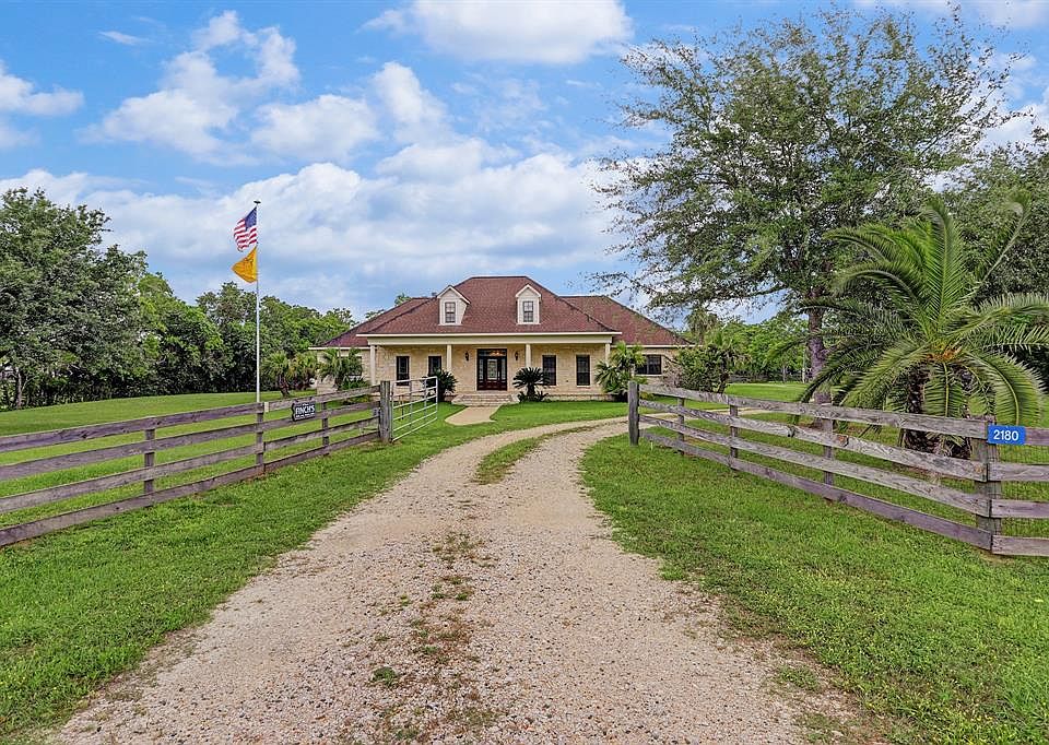 Gated entry leads to beautiful estate. Over 4000 square foot home, with tons of UPGRADES, and almost 2 acres (1.972) of complete serenity.
