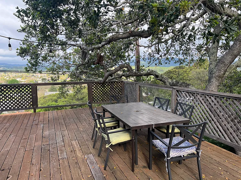 Large deck with table and chairs (shared)
