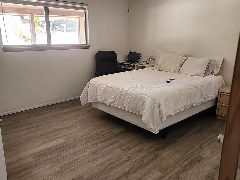Main level primary bedroom with adjoining shower bath